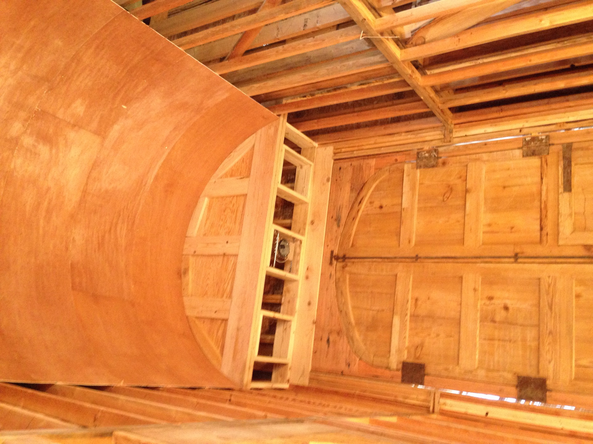 Custom barrel-vault ceiling and arched double doors built by Legacy Ridge Construction